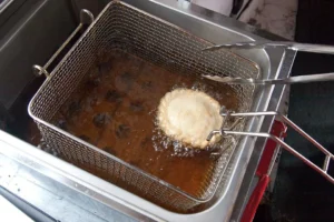 Deep fryer with dough in oil