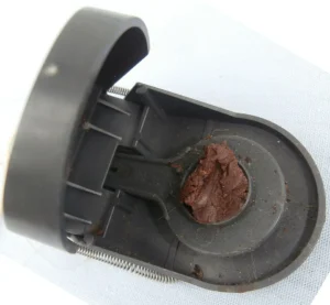 Plastic snap trap with Nutella as bait