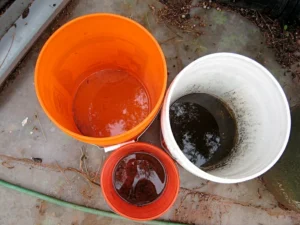 3 buckets of different sizes with water